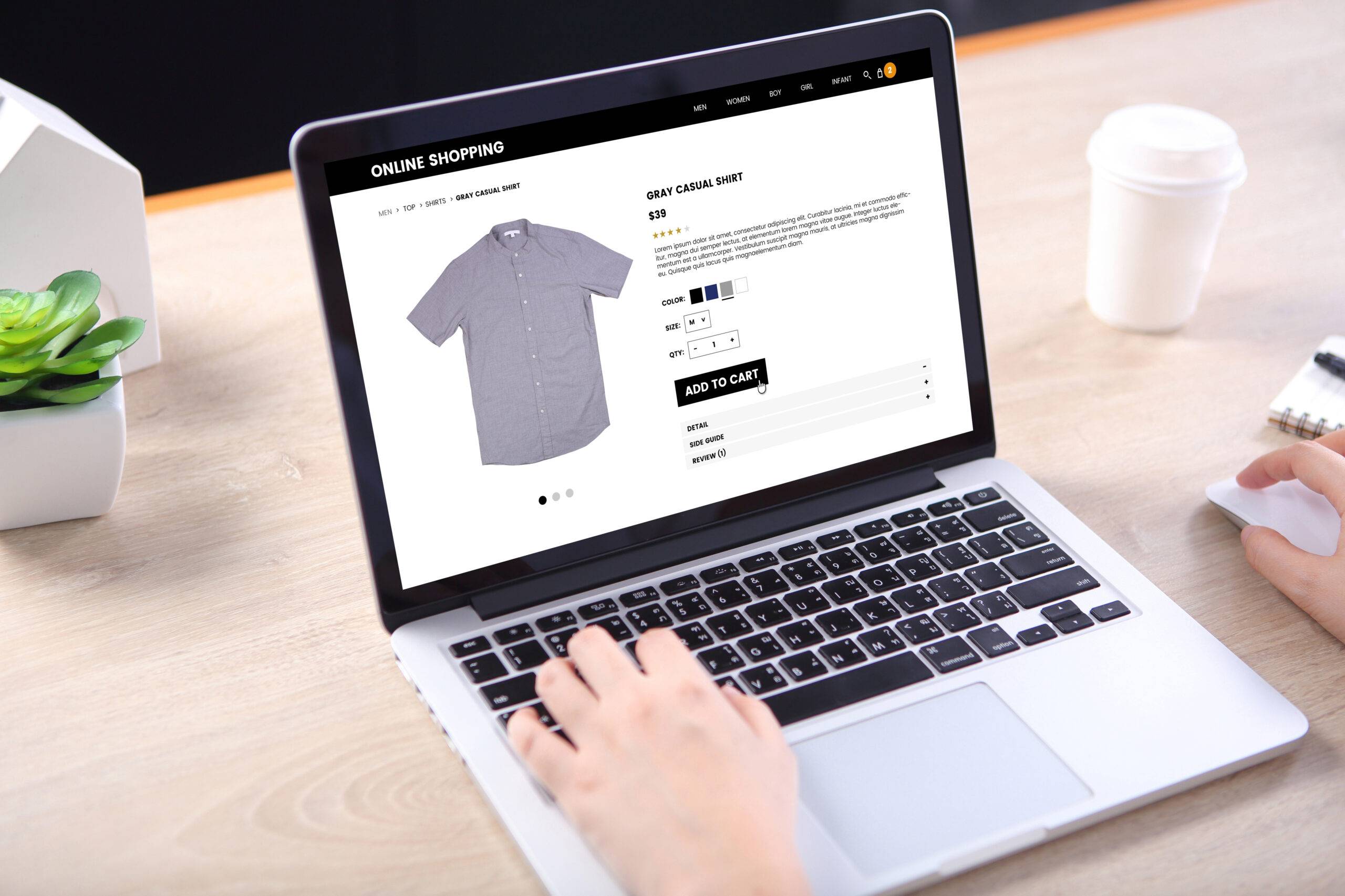 People buying casual shirt on ecommerce website with smart phone on wooden desk People buying casual shirt on ecommerce website with smart phone on wooden desk